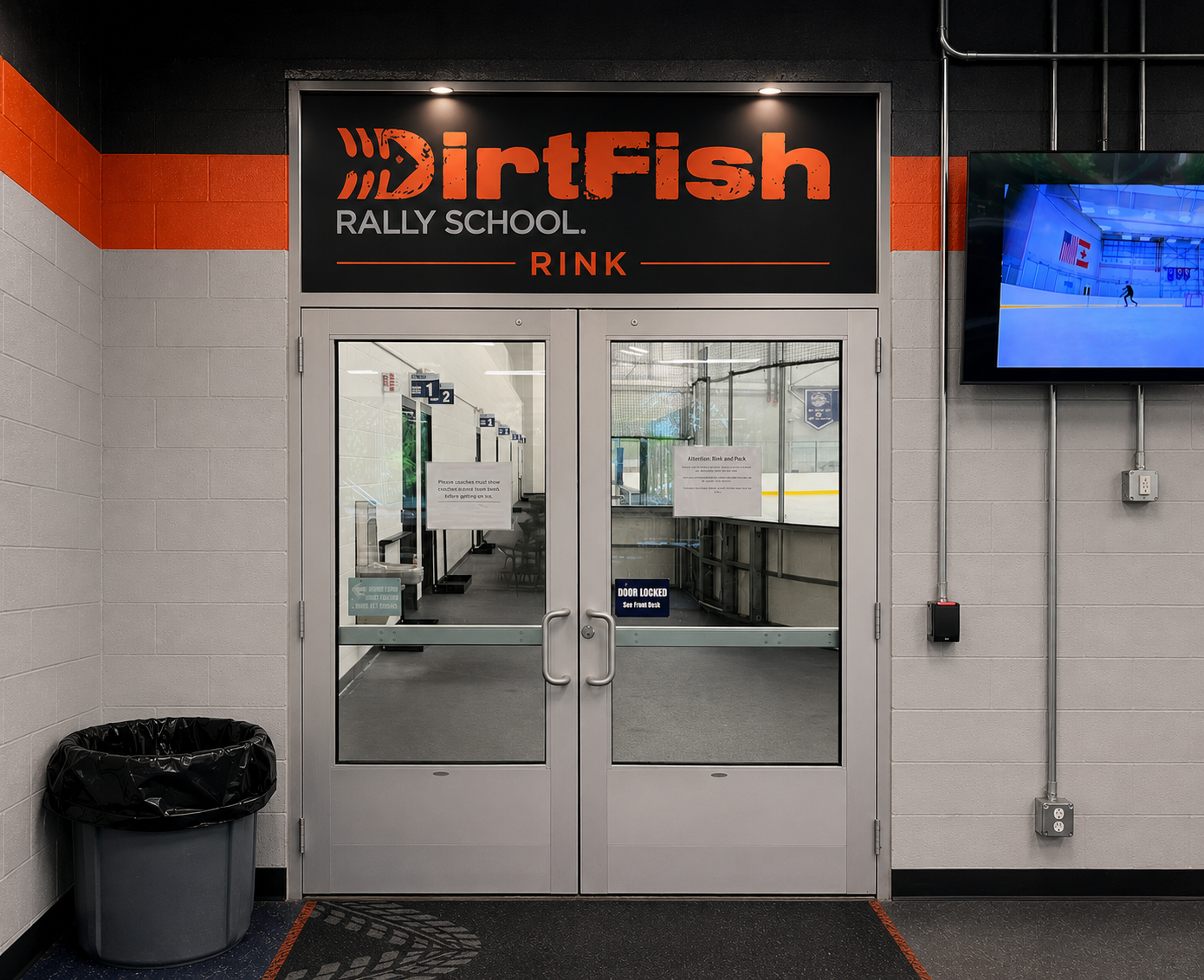 Mockup of DirtFish Rally School Rink branded signage above the rink entry doors